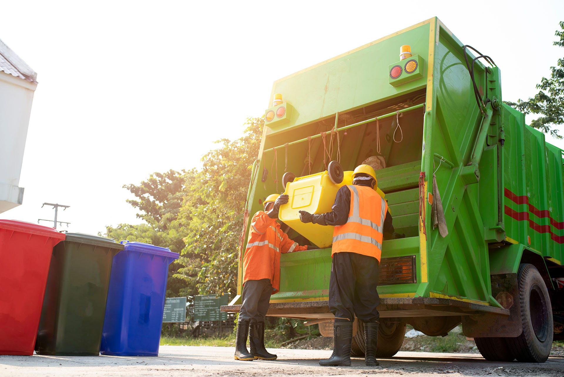 New Waste Reforms - Defra’s Simpler Recycling image shows waste disposal workers emptying recycling bins